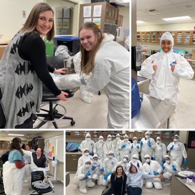 vet tech students putting on personal protective equipment