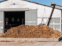 Manure compost pile outside of barn