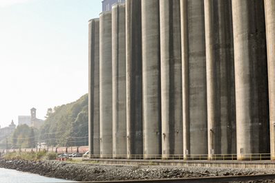 Gain silo next to a river.