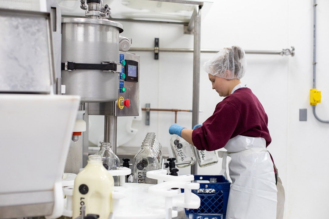 Woman bottling milk